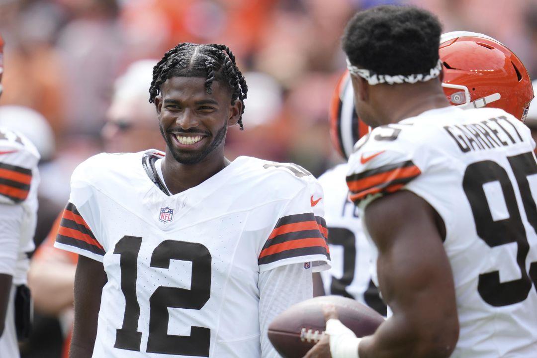 Cleveland Browns quarterback Shedeur Sanders (12) talks to defensive end Myles  Garrett (95) before a preseason game against the Los Angeles Rams on August  23. | Sandusky Register
