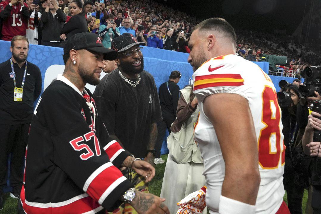 Brazilian soccer player, Neymar Jr. greets Chiefs tight end Travis Kelce  during warmups before Friday's game in Sao Paulo. | Sandusky Register