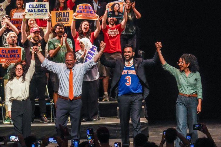 Democratic congressional candidates, Claire Valdez, Brad Lander and Darializa Avila Chevalier gesture on stage with Mayor Zohran Mamdani during a Get Out The Vote rally ahead of New York\'s primary election on June 18 in the Brooklyn borough of New York.