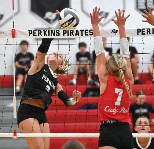 Perkins\' Brooklyn Cassidy hits past Bellevue\'s Alayna Raymond (7) during a match at Perkins High School on Monday, Aug. 31, 2026.