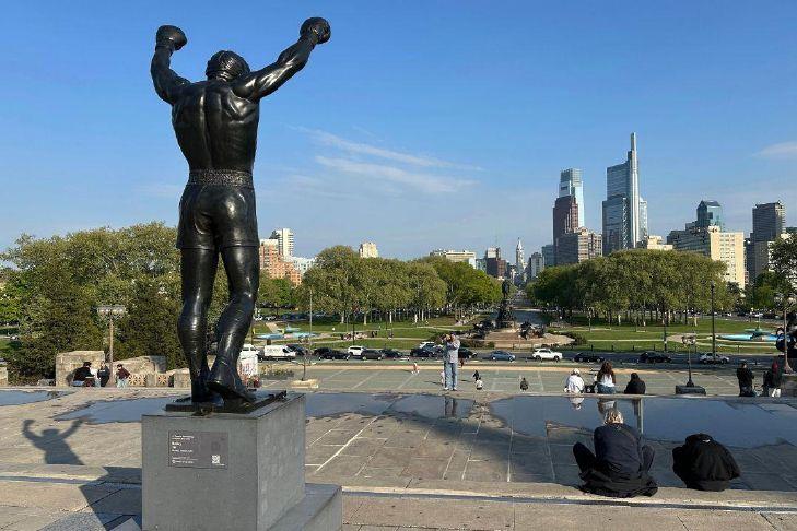 The Rocky statue overlooks the city skyline outside the Philadelphia Museum of...